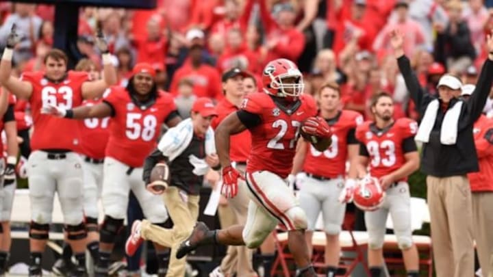 Sep 26, 2015; Athens, GA, USA; Georgia Bulldogs running back Nick Chubb (27) runs past the Georgia bench on his way to a touchdown against the Southern University Jaguars during the second half at Sanford Stadium. Georgia defeated Southern 48-6. Mandatory Credit: Dale Zanine-USA TODAY Sports
