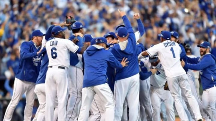 Oct 15, 2014; Kansas City, MO, USA; Kansas City Royals players celebrate on the field after defeating the Baltimore Orioles in game four of the 2014 ALCS playoff baseball game at Kauffman Stadium. The Royals swept the Orioles to advance to the World Series. Mandatory Credit: Peter G. Aiken-USA TODAY Sports