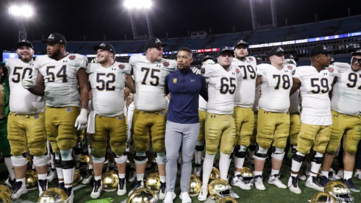 JACKSONVILLE, FL - DECEMBER 30: Head Coach Marcus Freeman of the Notre Dame Fighting Irish celebrates with his team after the game against the South Carolina Gamecocks at the 78th annual TaxSlayer Gator Bowl at TIAA Bank Field on January 2, 2021 in Jacksonvile, Florida. The Fighting Irish defeated The Gamecocks 45 to 38. (Photo by Don Juan Moore/Getty Images)