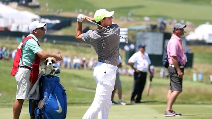 Jun 18, 2016; Oakmont, PA, USA; Rory McIlroy hits from the rough on the 3rd hole during the continuation of the second round of the U.S. Open golf tournament at Oakmont Country Club. Mandatory Credit: Charles LeClaire-USA TODAY Sports