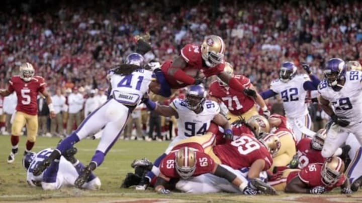 Aug 25, 2013; San Francisco, CA, USA; San Francisco 49ers running back Anthony Dixon (24) scores a touchdown against the Minnesota Vikings in the fourth quarter at Candlestick Park. The 49ers defeated the Vikings 34-14. Mandatory Credit: Cary Edmondson-USA TODAY Sports