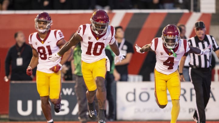 SALT LAKE CITY UT- OCTOBER 15: Kyron Hudson #10 of the USC Trojans celebrates scoring a touchdown with teammates Kyle Ford #81 and Mario Williams #4 during the first half of their game against the Utah Utes October 15, 2022 Rice-Eccles Stadium in Salt Lake City Utah. (Photo by Chris Gardner/ Getty Images)