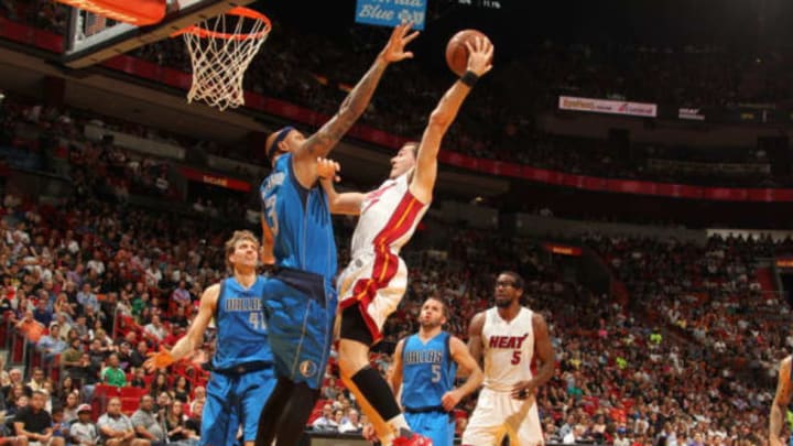 MIAMI, FL – JANUARY 1: Goran Dragic #7 of the Miami Heat shoots the ball against Charlie Villanueva #3 of the Dallas Mavericks on January 1, 2016 at American Airlines Arena in Miami, Florida. NOTE TO USER: User expressly acknowledges and agrees that, by downloading and or using this Photograph, user is consenting to the terms and conditions of the Getty Images License Agreement. Mandatory Copyright Notice: Copyright 2016 NBAE (Photo by Issac Baldizon/NBAE via Getty Images)