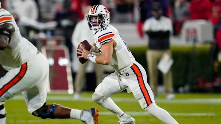 Oct 3, 2020; Athens, Georgia, USA; Auburn Tigers quarterback Bo Nix (10) rolls out looking to pass against the Georgia Bulldogs during the first half at Sanford Stadium. Mandatory Credit: Dale Zanine-USA TODAY Sports