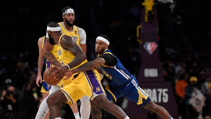 LOS ANGELES, CA - OCTOBER 12: Gary Payton II #0 of the Golden State Warriors knocks the ball from LeBron James #6 of the Los Angeles Lakers during the first half of a preseason basketball game at Staples Center on October 12, 2021 in Los Angeles, California. NOTE TO USER: User expressly acknowledges and agrees that, by downloading and/or using this Photograph, user is consenting to the terms and conditions of the Getty Images License Agreement. (Photo by Kevork Djansezian/Getty Images)