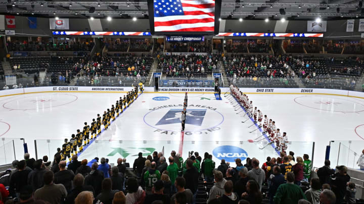 FARGO, NORTH DAKOTA – MARCH 30: The American International Yellow Jackets and the Denver Pioneers line up for the singing of the American national anthem before the NCAA Division I Men’s Ice Hockey West Regional Championship Final at Scheels Arena on March 30, 2019 in Fargo, North Dakota. (Photo by Sam Wasson/Getty Images)