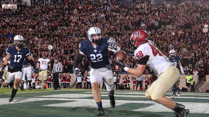 NEW HAVEN, CT - NOVEMBER 21: Ben Braunecker #48 of the Harvard Crimson catches a touchdown pass by the defense Matthew Oplinger #22 of the Yale Bulldogs in the second half on November 21, 2015 in New Haven, Connecticut. (Photo by Jim Rogash/Getty Images)