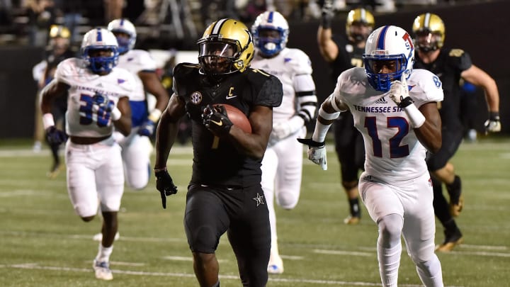 NASHVILLE, TN – OCTOBER 22: Ralph Webb #7 of the Vanderbilt Commodores runs away from Larry Wilhoite #12 of the Tennessee State Tigers during the first half at Vanderbilt Stadium on October 22, 2016 in Nashville, Tennessee. (Photo by Frederick Breedon/Getty Images)