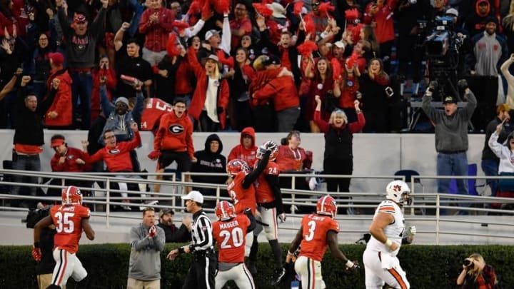 Nov 12, 2016; Athens, GA, USA; Georgia Bulldogs defensive back Maurice Smith (2) reacts with safety Dominick Sanders (24) after he intercepted a pass and returned it for a touchdown against the Auburn Tigers during the second half at Sanford Stadium. Georgia defeated Auburn 13-7. Mandatory Credit: Dale Zanine-USA TODAY Sports