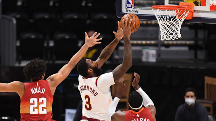 Feb 10, 2021; Denver, Colorado, USA; Cleveland Cavaliers center Andre Drummond (3) shoots the ball past Denver Nuggets forward Zeke Nnaji (22) and forward Paul Millsap (4) in the second quarter at Ball Arena. Mandatory Credit: Ron Chenoy-USA TODAY Sports Feb 10, 2021; Denver, Colorado, USA; Cleveland Cavaliers center Andre Drummond (3) shoots the ball past Denver Nuggets forward Zeke Nnaji (22) and forward Paul Millsap (4) in the second quarter at Ball Arena. Mandatory Credit: Ron Chenoy-USA TODAY Sports