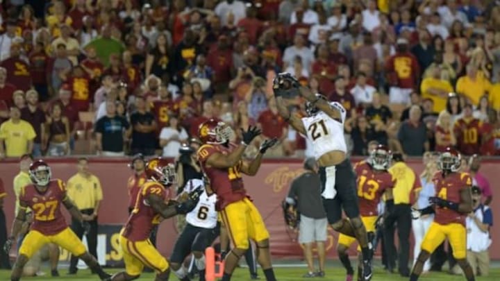 Oct 4, 2014; Los Angeles, CA, USA: Arizona State Sun Devils receiver Jaelen Strong (21) catches a 53-yard touchdown pass while defended by Southern California Trojans linebacker Hayes Pullard (10) on the final play of the game at Los Angeles Memorial Coliseum. Arizona State defeated USC 38-34. Mandatory Credit: Kirby Lee-USA TODAY Sports