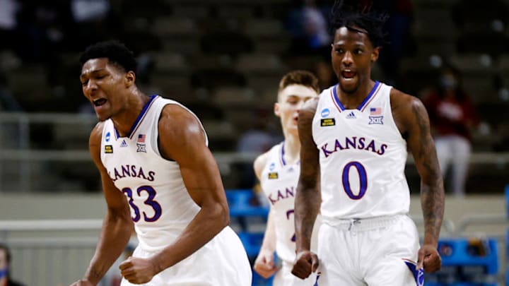 INDIANAPOLIS, INDIANA - MARCH 20: David McCormack #33 of the Kansas Jayhawks and Marcus Garrett #0 of the Kansas Jayhawks react to a basket during the first half against the Eastern Washington Eagles in the first round game of the 2021 NCAA Men's Basketball Tournament at Indiana Farmers Coliseum on March 20, 2021 in Indianapolis, Indiana. (Photo by Maddie Meyer/Getty Images)