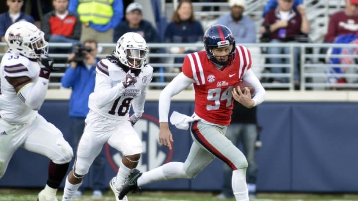 Nov 26, 2016; Oxford, MS, USA; Mississippi Rebels punter Will Gleeson (94) carries the ball after a fake punt during the second quarter of the game against the Mississippi State Bulldogs at Vaught-Hemingway Stadium. Mandatory Credit: Matt Bush-USA TODAY Sports