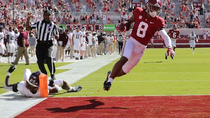 Oct 3, 2020; Tuscaloosa, Alabama, USA; Alabama wide receiver John Metchie III (8) floats into the end zone with a touchdown after catching a pass from Alabama quarterback Mac Jones (10) and scoring against Texas A&M at Bryant-Denny Stadium. Alabama defeated A&M 52-24. Mandatory Credit: Gary Cosby Jr/The Tuscaloosa News via USA TODAY Sports