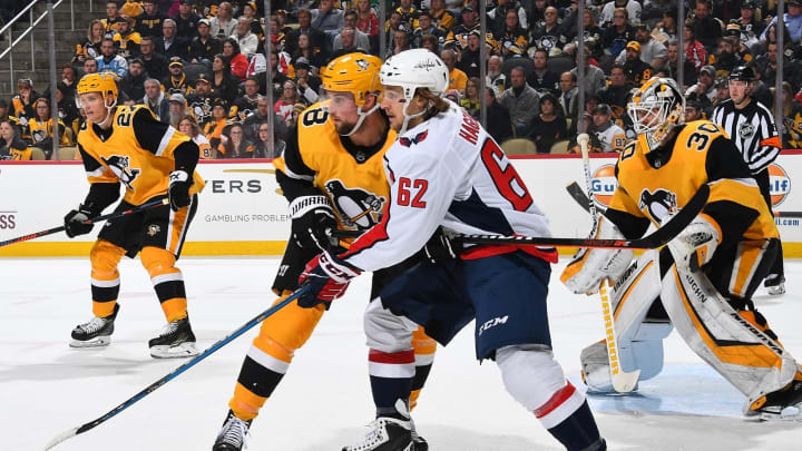 PITTSBURGH, PA – MARCH 12: Brian Dumoulin #8 of the Pittsburgh Penguins battles for position against Carl Hagelin #62 of the Washington Capitals at PPG Paints Arena on March 12, 2019 in Pittsburgh, Pennsylvania. (Photo by Joe Sargent/NHLI via Getty Images)