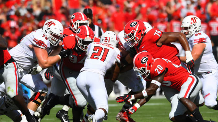 ATHENS, GA - SEPTEMBER 1: Michael Barnett #94, Michail Carter #76, and J. R. Reed #20 of the Georgia Bulldogs converge on Ahmaad Turner #21 of the Austin Peay Governors on September 1, 2018 in Athens, Georgia. (Photo by Scott Cunningham/Getty Images)