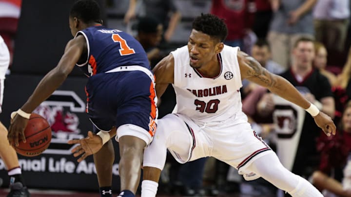 COLUMBIA, SC - JANUARY 24: South Carolina Gamecocks forward Chris Silva (30) tries for a steal as Auburn Tigers guard Jared Harper (1) drives to the basket during the second half on January 24, 2017 at Colonial Life Arena in Columbia, SC. South Carolina wins 98-69 over Auburn. (Photo by Jim Dedmon/Icon Sportswire via Getty Images)