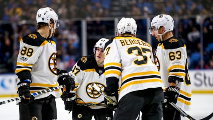 BUFFALO, NY - December 19: Boston Bruins defenseman Torey Krug (47) talks over the next play with teammates Boston Bruins right wing David Pastrnak (88), Boston Bruins center Patrice Bergeron (37) and Boston Bruins left wing Brad Marchand (63) during an NHL game between the Boston Bruins and Buffalo Sabres on December 19, 2017, at KeyBank Center in Buffalo, NY. (Jerome Davis/Icon Sportswire via Getty Images)