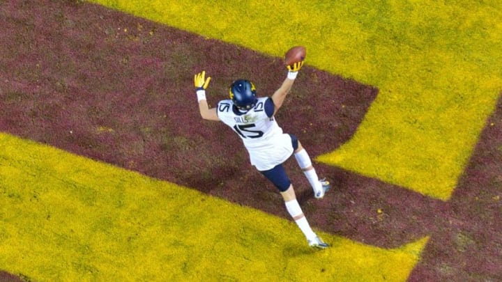 Jan 2, 2016; Phoenix, AZ, USA; West Virginia Mountaineers wide receiver David Sills (15) celebrates after scoring the game winning touchdown during the second half against the Arizona State Sun Devils at Chase Field during the Cactus Bowl. Mandatory Credit: Matt Kartozian-USA TODAY Sports