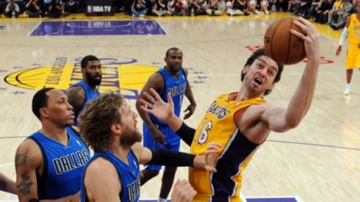 Apr 2, 2013; Los Angeles, CA, USA; Los Angeles Lakers power forward Pau Gasol (16) and Dallas Mavericks power forward Dirk Nowitzki (41) battle for a rebound during the game at the Staples Center. Lakers won 101-81. Mandatory Credit: Jayne Kamin-Oncea-USA TODAY Sports