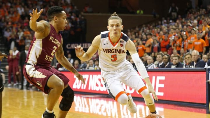 Dec 31, 2016; Charlottesville, VA, USA; Virginia Cavaliers guard Kyle Guy (5) dribbles the ball as Florida State Seminoles guard CJ Walker (2) defends in the second half at John Paul Jones Arena. The Seminoles won 60-58. Mandatory Credit: Geoff Burke-USA TODAY Sports