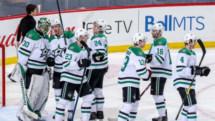 WINNIPEG, MB - MARCH 25: Dallas Stars players celebrate on the ice following a 5-2 victory over the Winnipeg Jets at the Bell MTS Place on March 25, 2019 in Winnipeg, Manitoba, Canada. (Photo by Jonathan Kozub/NHLI via Getty Images)