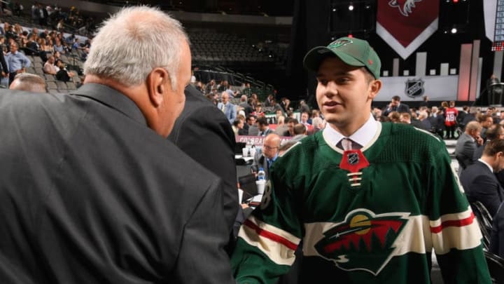 DALLAS, TX - JUNE 23: Alexander Khovanov greets his team after being selected 86th overall by the Minnesota Wild during the 2018 NHL Draft at American Airlines Center on June 23, 2018 in Dallas, Texas. (Photo by Brian Babineau/NHLI via Getty Images)