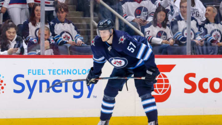 WINNIPEG, MB – APRIL 18: Tyler Myers #57 of the Winnipeg Jets gets set during a second period face-off against the St. Louis Blues in Game Five of the Western Conference First Round during the 2019 NHL Stanley Cup Playoffs at the Bell MTS Place on April 18, 2019 in Winnipeg, Manitoba, Canada. The Blues defeated the Jets 3-2 to lead the series 3-2. (Photo by Jonathan Kozub/NHLI via Getty Images)