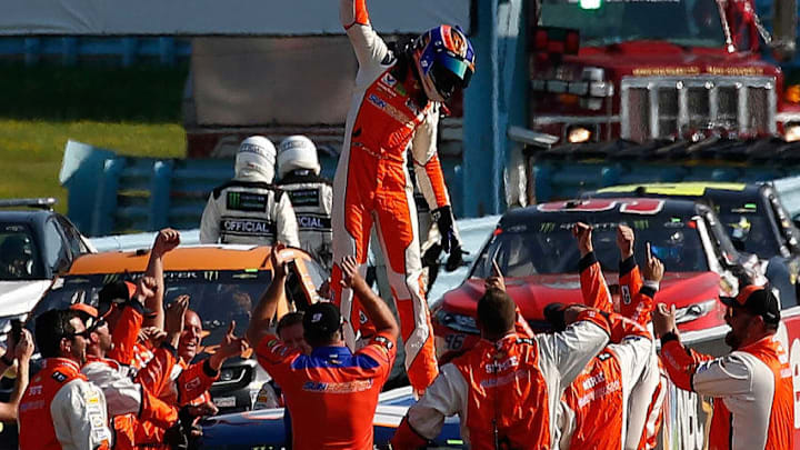 WATKINS GLEN, NY - AUGUST 05: Chase Elliott, driver of the #9 SunEnergy1 Chevrolet, celebrates is victory with his crew in the Monster Energy NASCAR Cup Series GoBowling at The Glen at Watkins Glen International on August 5, 2018 in Watkins Glen, New York. (Photo by Jeff Zelevansky/Getty Images)