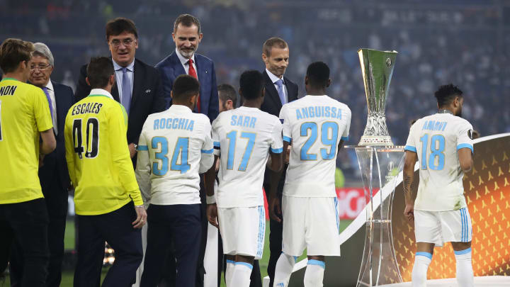 LYON, FRANCE – MAY 16: UEFA President Aleksander Ceferin and King Felipe of Spain greet dejected Marseille players after the UEFA Europa League Final between Olympique de Marseille and Club Atletico de Madrid at Stade de Lyon on May 16, 2018 in Lyon, France. (Photo by Maja Hitij/Getty Images)