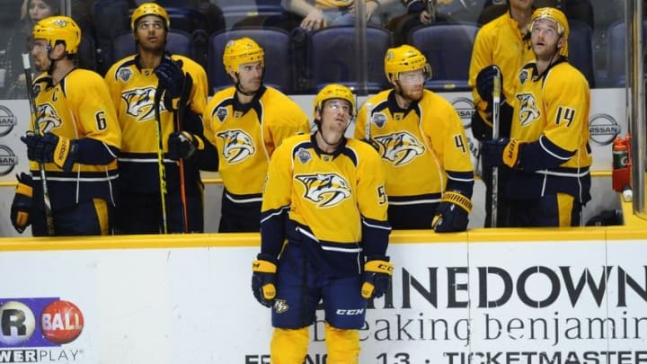 Oct 24, 2015; Nashville, TN, USA; Nashville Predators defenseman Roman Josi (59) and teammates react after a loss in overtime against the Pittsburgh Penguins at Bridgestone Arena. The Penguins won 2-1 in overtime. Mandatory Credit: Christopher Hanewinckel-USA TODAY Sports