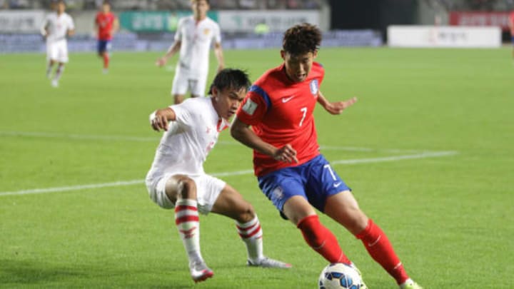 HWASUNG, SOUTH KOREA – SEPTEMBER 03: Son Heung-Min of South Korea compete for the ball with Souksavath Moukda of Laos during the 2018 FIFA World Cup Qualifier Round 2 – Group G match between South Korea and Laos at Hwaseong on September 3, 2015 in Hwasung, South Korea. (Photo by Chung Sung-Jun/Getty Images)