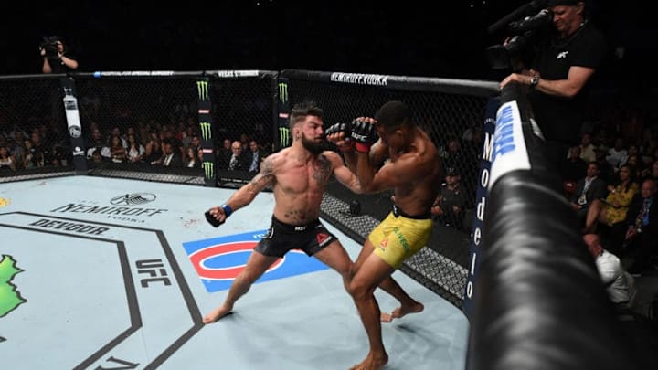 SUNRISE, FL - APRIL 27: (L-R) Mike Perry punches Alex Oliveira of Brazil in their welterweight bout during the UFC Fight Night event at BB&T Center on April 27, 2019 in Sunrise, Florida. (Photo by Jeff Bottari/Zuffa LLC/Zuffa LLC via Getty Images)