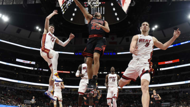 Chicago Bulls guard Max Strus (28) goes to the basket as Miami Heat forward Kelly Olynyk (9) and guard Tyler Herro (14) defend him during(David Banks-USA TODAY Sports)