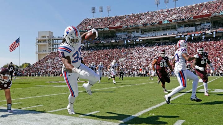 STARKVILLE MS -OCTOBER 17: Tight end Ricky Jones #33 of the Louisiana Tech Bulldogs tip toes down the sideline as he carries the ball during the second quarter of an NCAA college football game against the Mississippi State Bulldogs at Davis Wade Stadium on October 17, 2015 in Starkville, Mississippi. (Photo by Butch Dill/Getty Images)