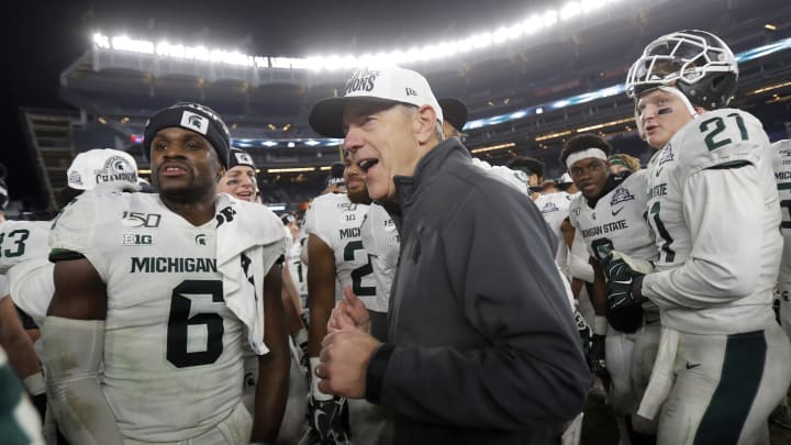 NEW YORK, NY – DECEMBER 27: Head coach Mark Dantonio of the Michigan State Spartans celebrates with his players after defeating the Wake Forest Demon Deacons in the New Era Pinstripe Bowl at Yankee Stadium on December 27, 2019 in the Bronx borough of New York City. Michigan State Spartans won 27-21. (Photo by Adam Hunger/Getty Images)