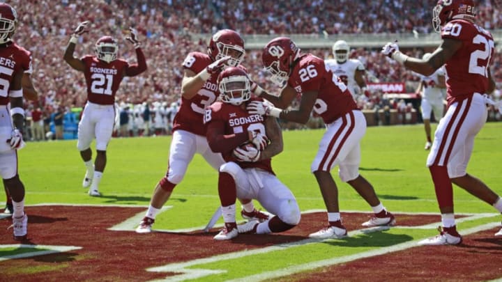 NORMAN, OK - SEPTEMBER 01: Linebacker Bryan Mead #38 and defensive back Caleb Murphy #26 congratulate linebacker Curtis Bolton #18 of the Oklahoma Sooners who recovered a blocked punt to score against the Florida Atlantic Owls at Gaylord Family Oklahoma Memorial Stadium on September 1, 2018 in Norman, Oklahoma. (Photo by Brett Deering/Getty Images)