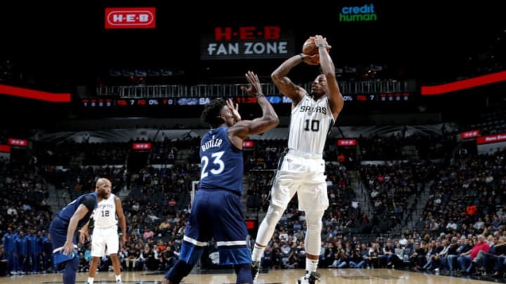 SAN ANTONIO, TX - OCTOBER 17: DeMar DeRozan #10 of the San Antonio Spurs shoots the ball against Jimmy Butler #23 of the Minnesota Timberwolves during a game on October 17, 2018 at the AT&T Center in San Antonio, Texas. NOTE TO USER: User expressly acknowledges and agrees that, by downloading and or using this photograph, user is consenting to the terms and conditions of the Getty Images License Agreement. Mandatory Copyright Notice: Copyright 2018 NBAE (Photos by Chris Covatta/NBAE via Getty Images)