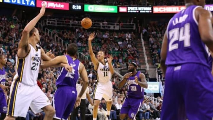 Apr 8, 2015; Salt Lake City, UT, USA; Utah Jazz guard Dante Exum (11) throws the ball up to the basket with the shot clock winding down during the third quarter against the Sacramento Kings at EnergySolutions Arena. Utah Jazz on the game 103-91. Mandatory Credit: Chris Nicoll-USA TODAY Sports