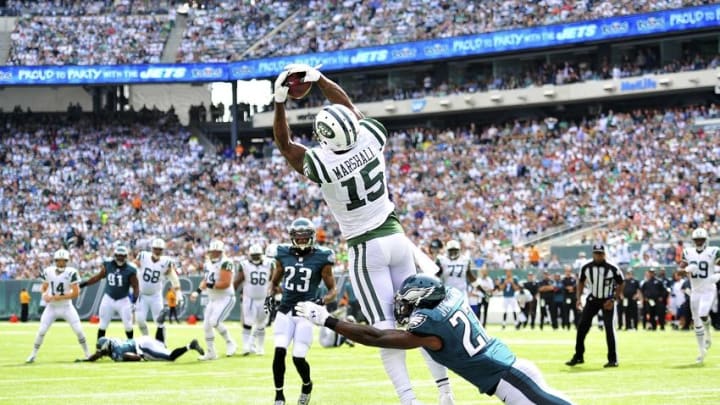 Sep 27, 2015; East Rutherford, NJ, USA; New York Jets wide receiver Brandon Marshall (15) catches a touchdown pass during the second quarter under pressure from Philadelphia Eagles free safety Malcolm Jenkins (27) at MetLife Stadium. Mandatory Credit: Steven Ryan-USA TODAY Sports