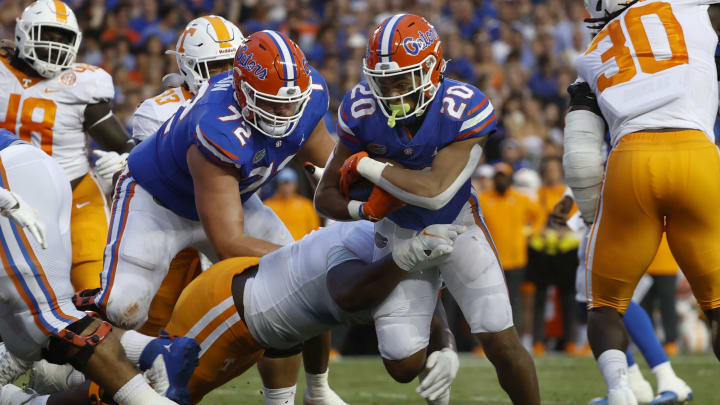 Sep 25, 2021; Gainesville, Florida, USA; Florida Gators running back Malik Davis (20) runs with the ball against the Tennessee Volunteers during the first quarter at Ben Hill Griffin Stadium. Mandatory Credit: Kim Klement-USA TODAY Sports