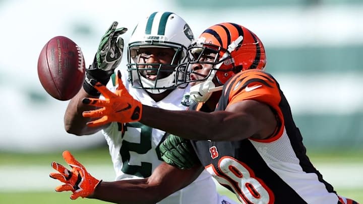 Sep 11, 2016; East Rutherford, NJ, USA; Cincinnati Bengals wide receiver A.J. Green (18) catches a pass in front of New York Jets corner back Darrelle Revis (24) during the fourth quarter at MetLife Stadium. Mandatory Credit: Brad Penner-USA TODAY Sports