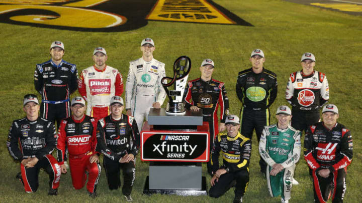 LAS VEGAS, NEVADA - SEPTEMBER 14: John Hunter Nemechek, driver of the #23 Berry's Manufacturing Chevrolet, Justin Allgaier, driver of the #7 BRANDT Professional Agriculture Chevrolet, Noah Gragson, driver of the #9 Switch Chevrolet, Brandon Jones, driver of the #19 Juniper Toyota, Justin Haley, driver of the #11 LeafFilter Gutter Protection Chevrolet, Cole Custer, driver of the #00 Haas Automation Ford, Chase Briscoe, driver of the #98 Ford Performance Ford, Michael Annett, driver of the #1 Pilot/Flying J Chevrolet, Austin Cindric, driver of the #22 MoneyLion Ford, Tyler Reddick, driver of the #2 TAME the BEAST Chevrolet, Ryan Sieg, driver of the #39 RSS Racing Chevrolet, Christopher Bell, driver of the #20 Rheem/Smurfit Kappa Toyota, pose for a photo as the 16 playoff contenders following the NASCAR Xfinity Series Rhino Pro Trucks Outfitters 300 at Las Vegas Motor Speedway on September 14, 2019 in Las Vegas, Nevada. (Photo by Jonathan Ferrey/Getty Images)