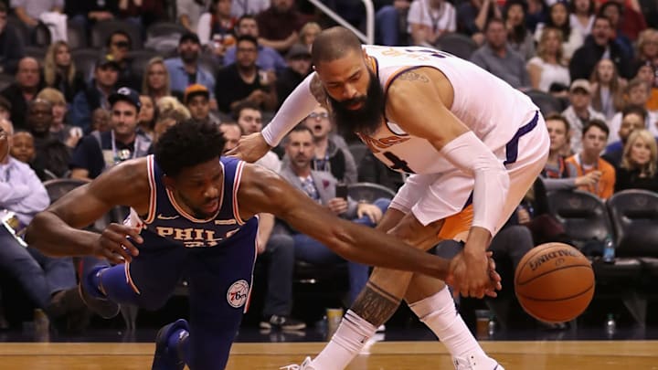 PHOENIX, AZ – DECEMBER 31: Joel Embiid #21 of the Philadelphia 76ers and Tyson Chandler #4 of the Phoenix Suns attempt to control a loose ball during the second half of the NBA game at Talking Stick Resort Arena on December 31, 2017, in Phoenix, Arizona. The 76ers defeated the Suns 123-110. NOTE TO USER: User expressly acknowledges and agrees that, by downloading and or using this photograph, User is consenting to the terms and conditions of the Getty Images License Agreement. (Photo by Christian Petersen/Getty Images)