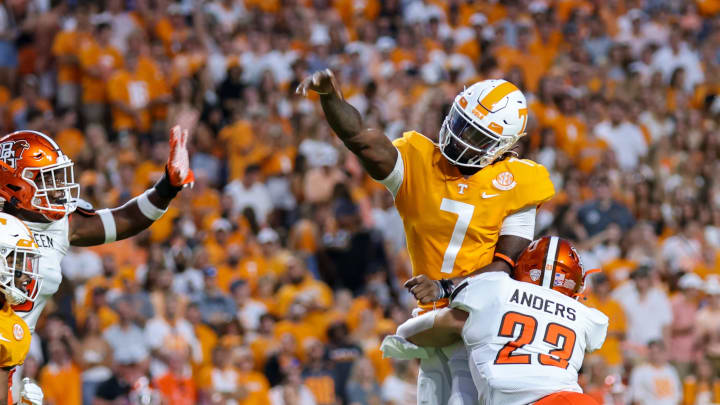 Sep 2, 2021; Knoxville, Tennessee, USA; Tennessee Volunteers quarterback Joe Milton III (7) throws the ball against Bowling Green Falcons linebacker Darren Anders (23) during the first quarter at Neyland Stadium. Mandatory Credit: Randy Sartin-USA TODAY Sports