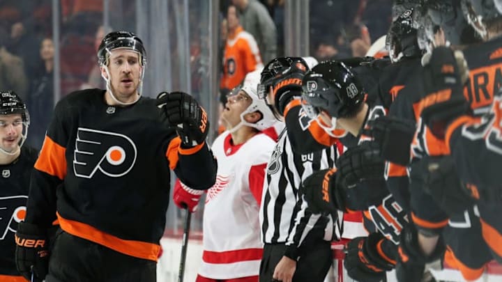 PHILADELPHIA, PA - NOVEMBER 29: Kevin Hayes #13 of the Philadelphia Flyers celebrates his third period goal against the Detroit Red Wings with his teammates on the bench on November 29, 2019 at the Wells Fargo Center in Philadelphia, Pennsylvania. (Photo by Len Redkoles/NHLI via Getty Images)
