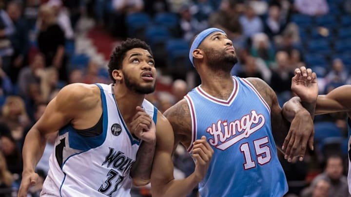 Dec 18, 2015; Minneapolis, MN, USA; Minnesota Timberwolves center Karl-Anthony Towns (32) and Sacramento Kings forward DeMarcus Cousins (15) rebound in the second quarter at Target Center. Mandatory Credit: Brad Rempel-USA TODAY Sports