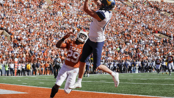 AUSTIN, TX – NOVEMBER 03: David Sills V #13 of the West Virginia Mountaineers catches a pass for a touchdown defended by Josh Thompson #29 of the Texas Longhorns in the second quarter at Darrell K Royal-Texas Memorial Stadium on November 3, 2018 in Austin, Texas. (Photo by Tim Warner/Getty Images)