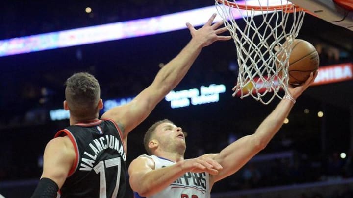 November 21, 2016; Los Angeles, CA, USA; Los Angeles Clippers forward Blake Griffin (32) moves in to score a basket against Toronto Raptors center Jonas Valanciunas (17) during the second half at Staples Center. Mandatory Credit: Gary A. Vasquez-USA TODAY Sports
