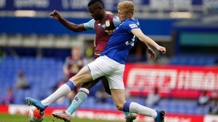 Aston Villa's Tanzanian striker Mbwana Samatta (L) vies with Everton's English defender Jarrad Branthwaite during the English Premier League football match between Everton and Aston Villa at Goodison Park in Liverpool, north west England on July 16, 2020. (Photo by Dave Thompson / POOL / AFP) / RESTRICTED TO EDITORIAL USE. No use with unauthorized audio, video, data, fixture lists, club/league logos or 'live' services. Online in-match use limited to 120 images. An additional 40 images may be used in extra time. No video emulation. Social media in-match use limited to 120 images. An additional 40 images may be used in extra time. No use in betting publications, games or single club/league/player publications. / (Photo by DAVE THOMPSON/POOL/AFP via Getty Images)